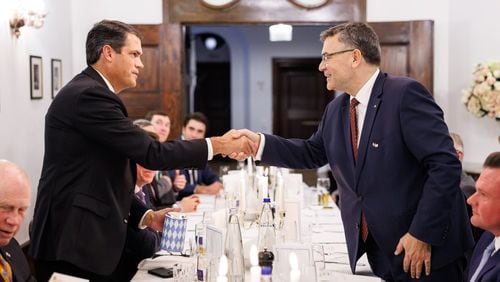 Then-Lt. Gov. Geoff Duncan, left, shakes hands with Florian Herrmann, a member of the Bavarian State Parliament, during a trip to Germany. The price tag for the 14-member delegation Duncan led to Europe shortly before leaving office has now reached about $110.000.