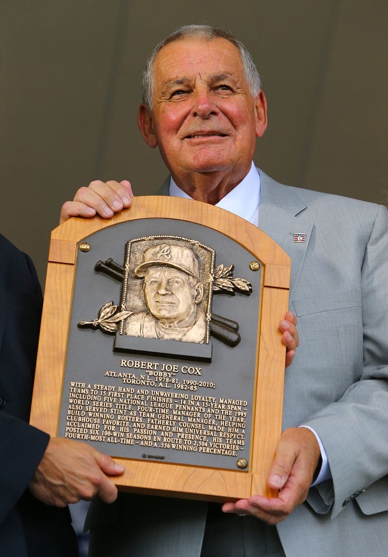 Bobby Cox is presented his plaque during the National Baseball Hall of Fame Induction Ceremony at Clark Sports Center on Sunday, July 27, 2014, in Cooperstown.   CURTIS COMPTON / CCOMPTON@AJC.COM