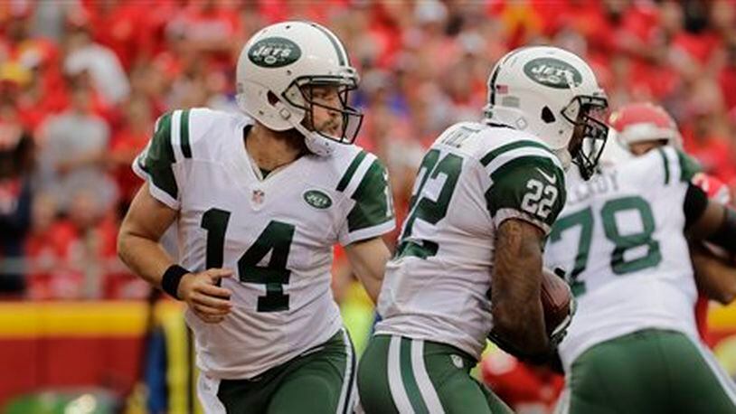 In this file photo, New York Jets quarterback Ryan Fitzpatrick (14) hands the ball to running back Matt Forté (22) during the first half of an NFL football game against the Kansas City Chiefs in Kansas City, Mo., Sunday, Sept. 25, 2016. (AP Photo/Charlie Riedel)