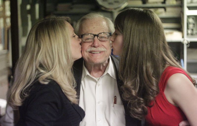 Jill Hamrick (left) and Courtney Smith give Dante a kiss. Dante, who divorced young and never remarried, says he spends 86 hours a week on the floor of the club and talking to his customers. He refers to restaurant staff as his family and has vowed to give them money from the restaurant's pending sale.