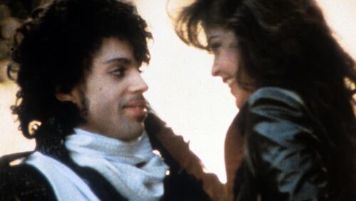 Prince embraces Apollonia Kotero in a scene from the film "Purple Rain." (Photo by Warner Brothers/Getty Images)