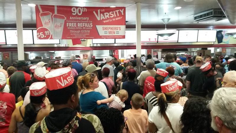 Hundreds of diners turned out on Saturday, Aug. 18, 2018, to take part in The Varsity’s 90th birthday celebration, which included all menu items at a price of 90 cents. (Photo: MATT KEMPNER / AJC)