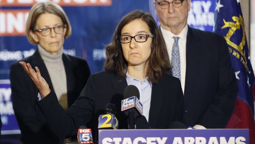 Lauren Groh-Wargo, Stacey Abrams' campaign manager, stands with attorneys at a Thursday press conference, discussing the Abrams campaign's pending legal actions. BOB ANDRES / BANDRES@AJC.COM
