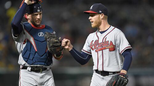 Catcher Tyler Flowers of the Braves taps glove to fist with pitcher Mike Foltynewicz after Foltynewicz stuck out Jed Lowrie of the Oakland Athletics to end the six inning at Oakland Alameda Coliseum on June 30, 2017 in Oakland, California. (Photo by Thearon W. Henderson/Getty Images)