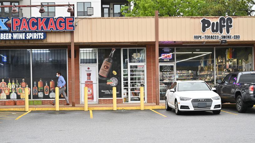 May 12, 2021 Decatur - Puff Smoke Shop is located between the liquor store and clothing alteration store on E. College Ave. in Decatur on Wednesday, May 12, 2021. (Hyosub Shin / Hyosub.Shin@ajc.com)