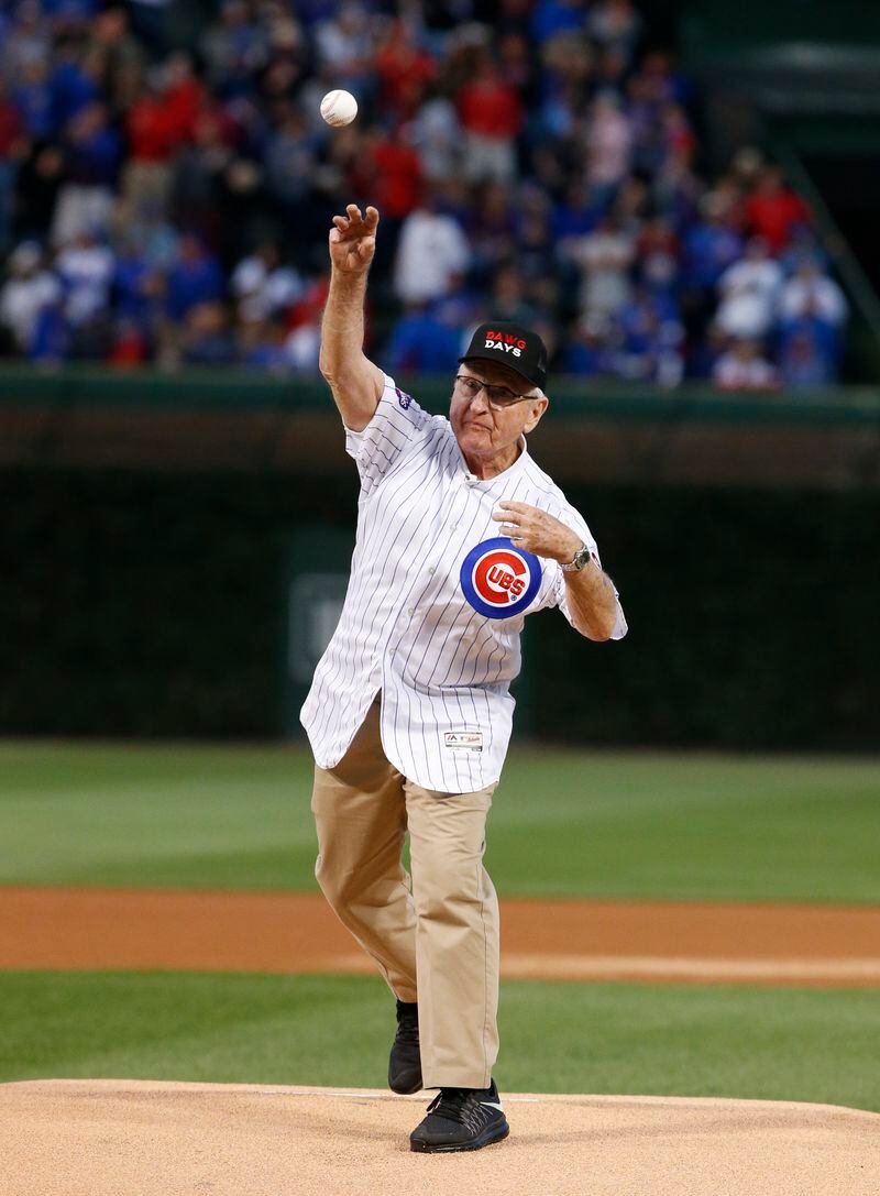  Former University of Georgia football coach Vince Dooley lets fly with a ceremonial first pitch before the start of Friday's Cubs-Brewers game. (AP Photo/Nam Y. Huh)
