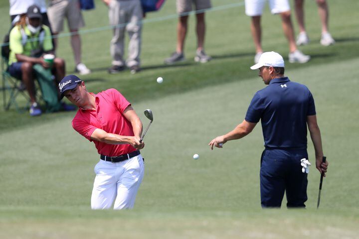 April 7, 2021, Augusta: Justin Thomas and Jordan Spieth practice on the second hole during their practice round for the Masters at Augusta National Golf Club on Wednesday, April 7, 2021, in Augusta. Curtis Compton/ccompton@ajc.com
