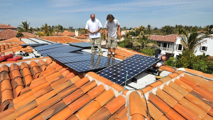 As the price of solar panels has come down, proponents have argued they will become a cost-saver to businesses and consumers. But they still take years to pay for themselves. (AJC file photo)