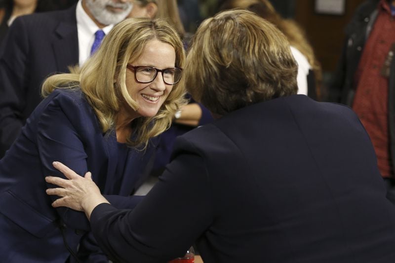 WASHINGTON, DC - SEPTEMBER 27:  Dr. Christine Blasey Ford shakes hands after the Senate Judiciary Committee hearing on the nomination of Brett Kavanaugh to be an associate justice of the Supreme Court of the United States, on Capitol Hill September 27, 2018 in Washington, DC. A professor at Palo Alto University and a research psychologist at the Stanford University School of Medicine, Ford has accused Supreme Court nominee Judge Brett Kavanaugh of sexually assaulting her during a party in 1982 when they were high school students in suburban Maryland. (Photo By Michael Reynolds-Pool/Getty Images)