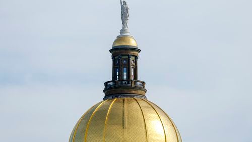The top of the Georgia State Capitol building in Atlanta on Tuesday, Feb. 7, 2023. (Jason Getz / Jason.Getz@ajc.com)