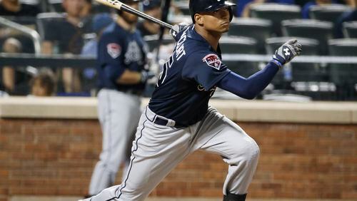 Atlanta Braves catcher Christian Bethancourt hits an eighth-inning RBI single that scored the Braves Chris Johson in a baseball game in New York, Monday, July 7, 2014. (AP Photo/Kathy Willens)