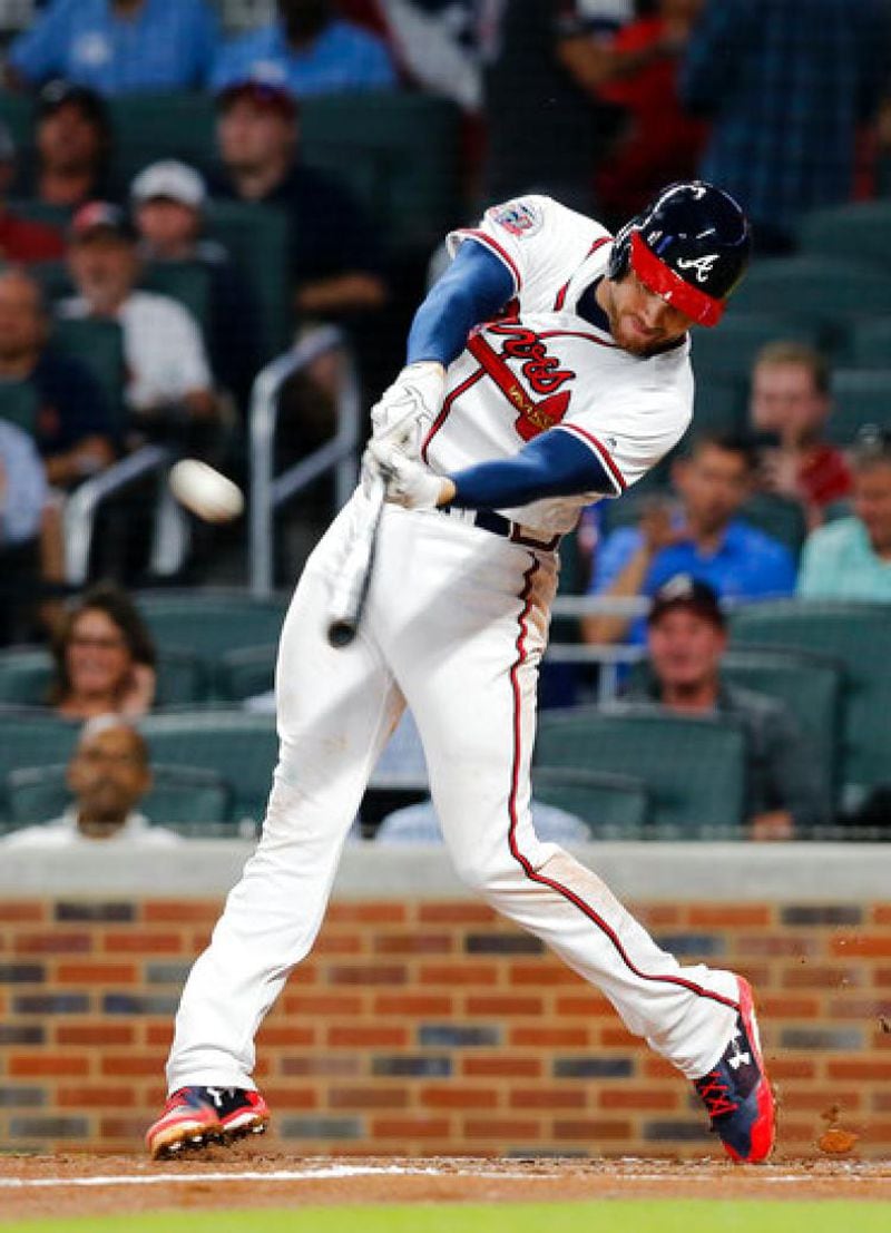  That sweet swing: Freddie Freeman connects on a two-run homer in the third inning Monday (AP photo)