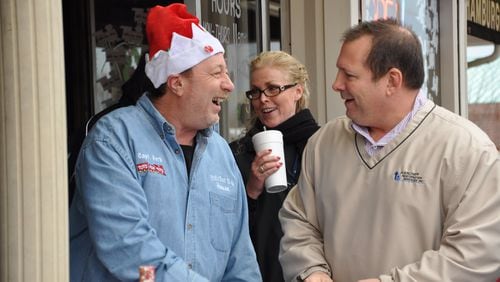 Paul Letalien shares a light moment with Captain Herb Emory (left) and another Toys for Tots supporter at last year's Marine Toys for Tots Foundation charity event. The yearly celebration was held at Fred's Bar-B-Q House in Lithia Springs. Captain Herb died earlier this year, and the iconic WSB radio traffic reporter's colleagues are carrying on his annual Toys for Tots drive this year in his memory. CONTRIBUTED BY PAUL LETALIEN