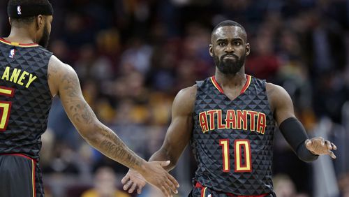 Atlanta Hawks’ Tim Hardaway Jr., right, is congratulated by Malcolm Delaney after shooting a3-point basket in the second half of an NBA basketball game against the Cleveland Cavaliers, Friday, April 7, 2017, in Cleveland. (AP Photo/Tony Dejak)