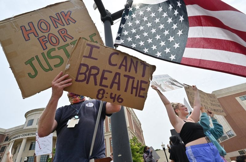 Protesters demonstrate outside the Forsyth County Courthouse in Cumming during a peaceful protest for unity and equality in honor of George Floyd, Black Lives Matter and encouraging community policing and accountability on June 6, 2020. HYOSUB SHIN / HYOSUB.SHIN@AJC.COM