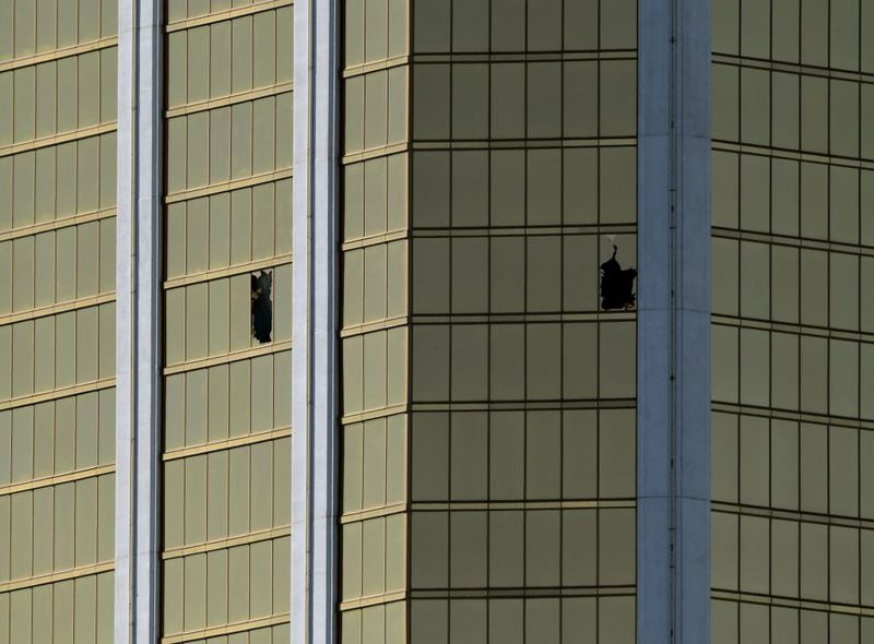 The damaged windows on the 32nd floor room that was used by the shooter in the Mandalay Hotel after a gunman killed at least 58 people and wounded more than 500 others when he opened fire on a country music concert in Las Vegas, Nevada on October 2, 2017. Police said the gunman, a 64-year-old local resident named as Stephen Paddock, had been killed after a SWAT team responded to reports of multiple gunfire from the 32nd floor of the Mandalay Bay, a hotel-casino next to the concert venue.         (MARK RALSTON/AFP/Getty Images)