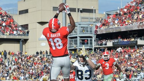 Georgia defensive back Deandre Baker (18) intercepts a pass intended for Georgia Tech wide receiver Brad Stewart (83) in the second half of an NCAA college football game at Bobby Dodd Stadium on Saturday, November 25, 2017. 
 HYOSUB SHIN / HSHIN@AJC.COM