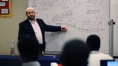 Muhammad Ninowy teaches a class in the “Islamic Creed”, or “Aqeeda”, at the Madina Institute in Duluth. The Institute offers several seminary certificate programs for young Muslims who wish to learn more about their religion. Community leaders say having American born, American trained religious leaders is important to the community and a bulwark against potential radicalization. BOB ANDRES /BANDRES@AJC.COM
