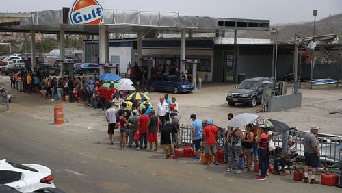 People wait in line for gas in Corozal, Puerto Rico, on Thursday, apparently a common sight across the island. (Getty Images / Joe Raedle)