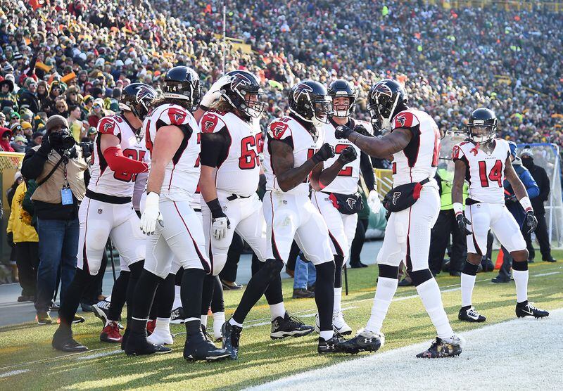 GREEN BAY, WISCONSIN - DECEMBER 09: Julio Jones #11 of the Atlanta Falcons celebrates with teammates after scoring a touchdown during the first half of a game against the Green Bay Packers at Lambeau Field on December 09, 2018 in Green Bay, Wisconsin. (Photo by Stacy Revere/Getty Images)
