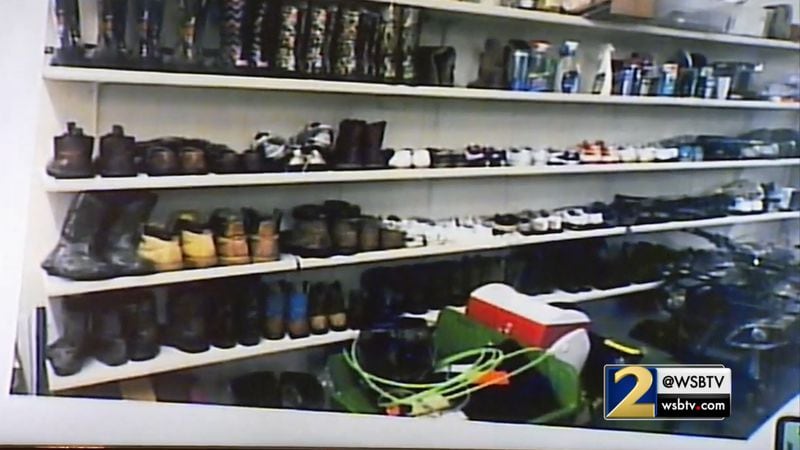 A photo of the "communal boot rack" at the McIver's ranch is shown to the court as part of Annie Anderson's testimony, during the Tex McIver murder trial on April 12, 2018 at the Fulton County Courthouse. (Channel 2 Action News)