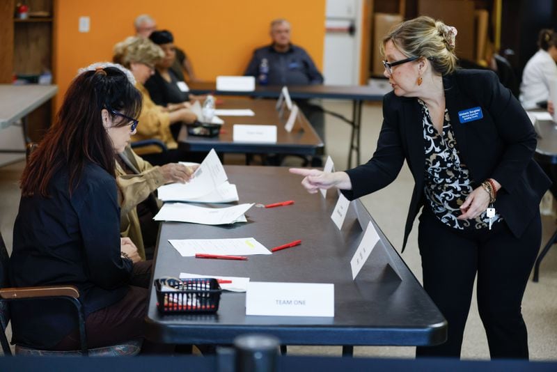 Spalding County Elections Supervisor Kimberly Slaughter gives directions to poll workers during a hand count of the ballots on Thursday. Miguel Martinez /miguel.martinezjimenez@ajc.com