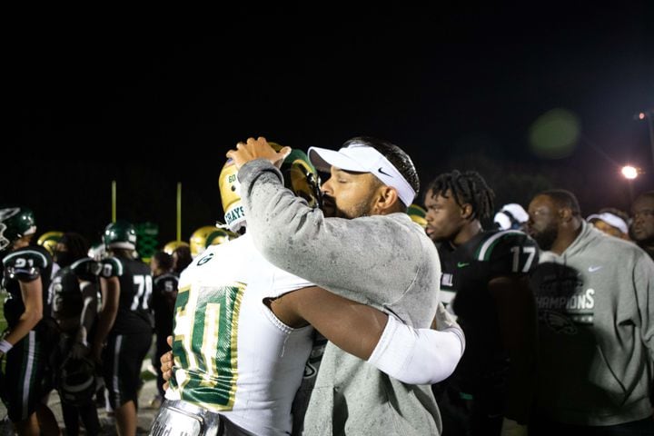 Players and coaches hug after a GHSA high school football game between the Collins Hill Eagles and the Grayson Rams at Collins Hill High in Suwanee, GA., on Friday, December 3, 2021. (Photo/ Jenn Finch)