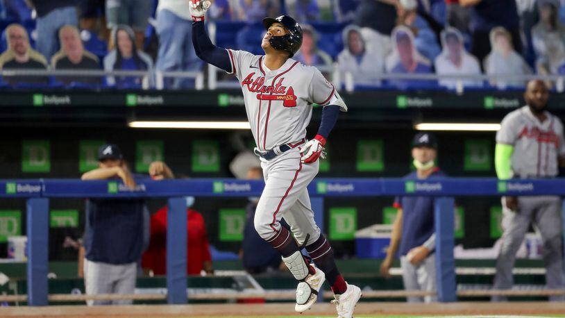 Atlanta Braves Cristian Pache celebrates as he rounds the bases after his grand slam home run against the Toronto Blue Jays during the second inning of a baseball game Saturday, May 1, 2021, in Dunedin, Fla. (AP Photo/Mike Carlson)