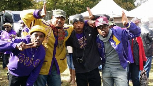 Illya E. Davis (gold sweater) enjoys Clark Atlanta University's homecoming with some college brothers. Davis is the Associate Director of the Honors Program at CAU and the campus advisor for the Beta Psi Chapter of Omega Psi Phi.