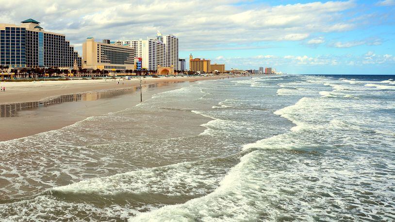 A boy was standing in waist-deep water on Daytona Beach when something bit him on the foot, “presumably a shark,” officials said. (File photo)
