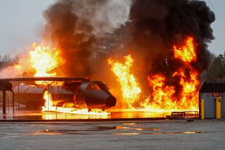 A fake airplane is set on fire as Hartsfield-Jackson International Airport held a full-scale preparedness exercise, known as “Big Bird,” with Atlanta Firefighters, law enforcement, rescue personnel, and nearly 70 volunteers participating at the Fire Training Center on Wednesday, March 6, 2024. The Airport Certification Manual and federal regulations mandate this critical exercise every 36 months.
Miguel Martinez /miguel.martinezjimenez@ajc.com