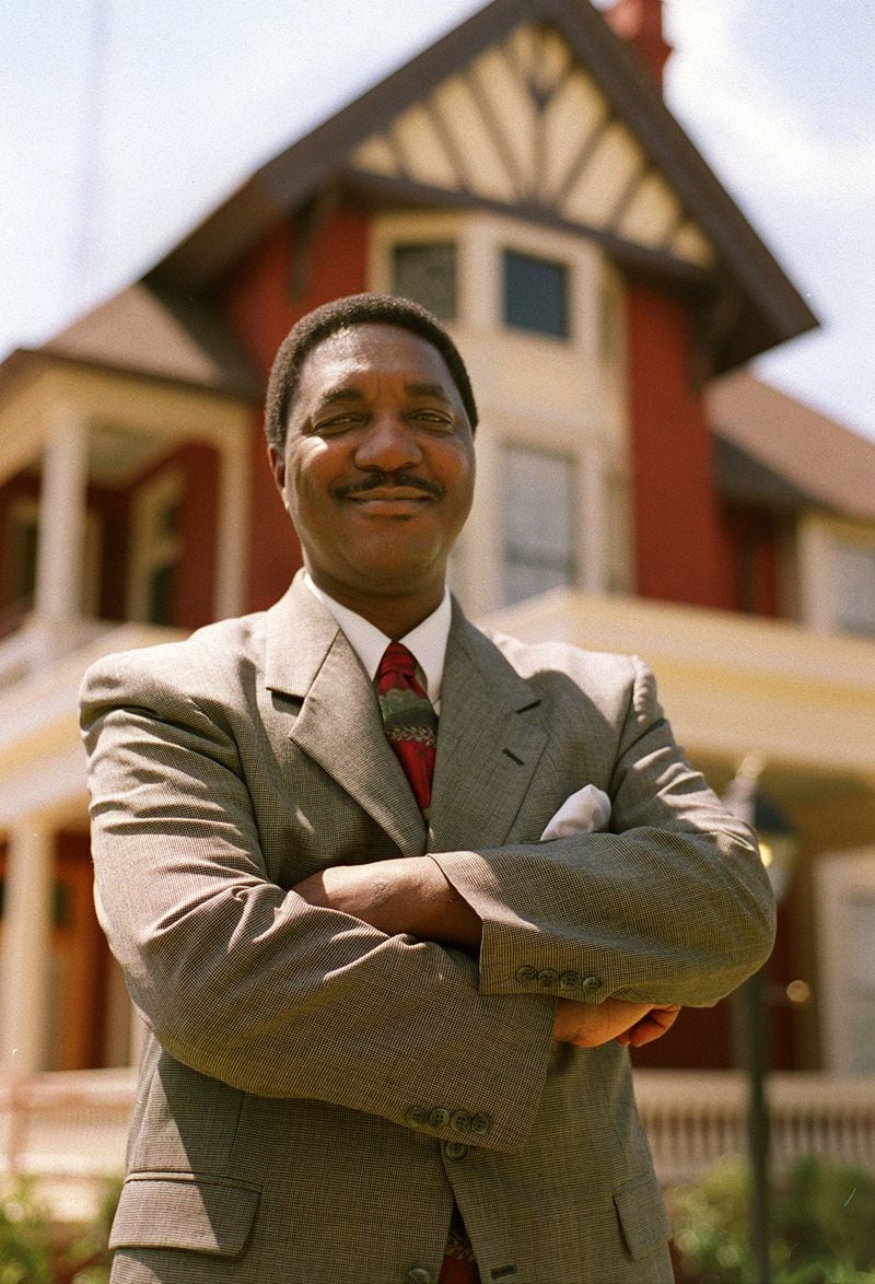Ira Joe Johnson in 2012. Johnson is posing in front of the Margaret Mitchell House on Peachtree Street. He wrote a book about how Margaret Mitchell and Benjamin Mays worked together to help race relations. (Frank Niemeir/AJC file)