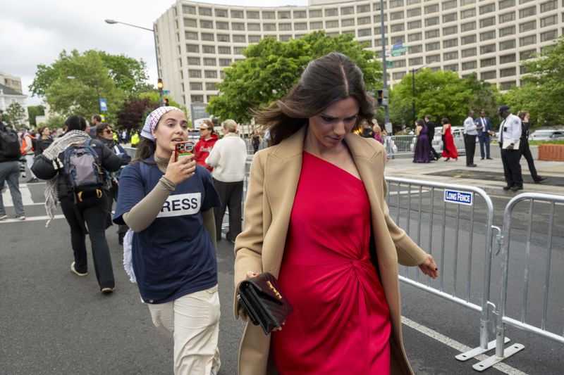Demonstrators protest as guests arrive at the White House Correspondents' Association Dinner at the Washington Hilton on Saturday, April 27, 2024, in Washington. (AP Photo/Kevin Wolf)