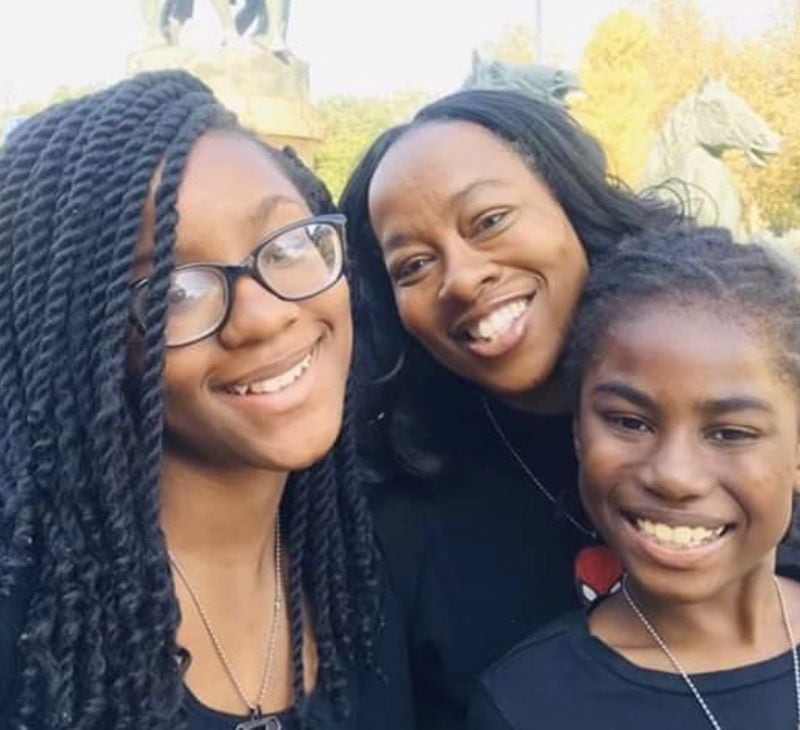 DaVina Jackson (center) and her children, daughter JeNaii (left) and son JeKaii (right), lived off of a 50-pound bag of rice while they were voluntarily confined to their apartment in Nanjing, China, before they were able to find flights home to the United States. CONTRIBUTED: DAVINA JACKSON