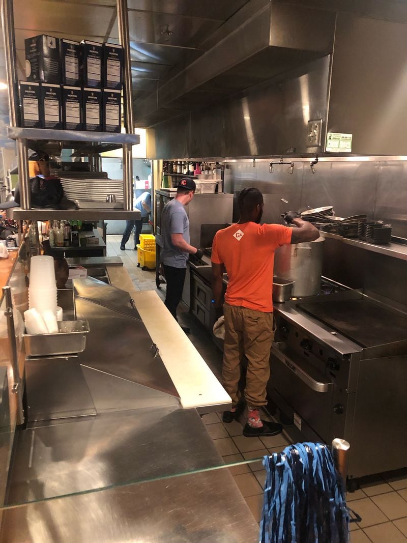 "Four (employees) on the line is pretty tight," says Porch Light Latin Kitchen chef-owner Andre Gomez about the small kitchen at his Smyrna restaurant. "All the braising and smoking and confit that we do. A whole pig: We ve done up to five in a day!"
