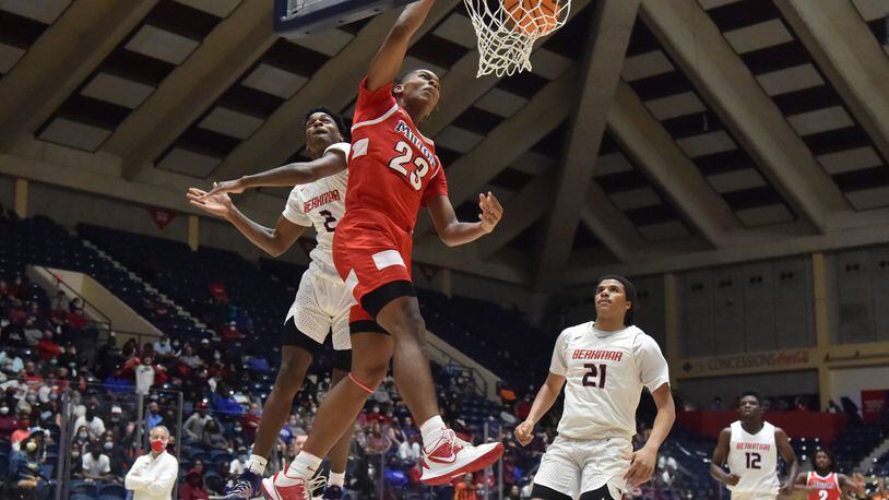 March 13, 2021 Macon - Milton's Kendall Campbell (23) gets a shot off past Berkmar's Jermahri Hill (2) during the 2021 GHSA State Basketball Class AAAAAAA Boys Championship game at the Macon Centreplex in Macon on Saturday, March 13, 2021 Milton won 52-47 over Berkmar. (Hyosub Shin / Hyosub.Shin@ajc.com)