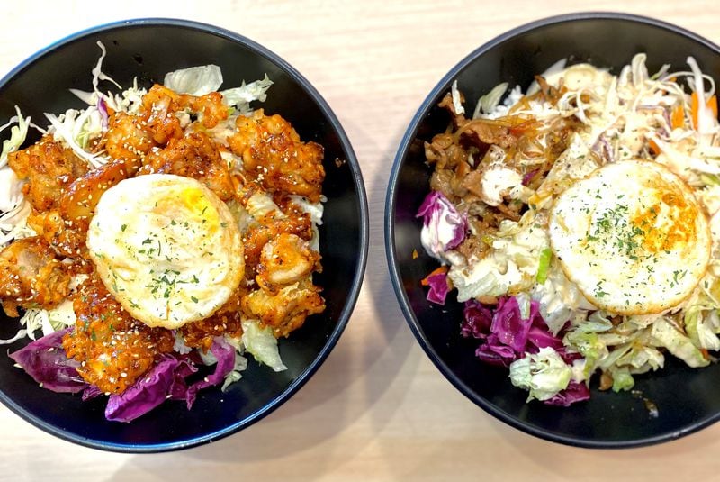 Tiger K Cupbob’s namesake dish is a fried-rice bowl with veggies, a fried egg and choice of toppings. Pictured here: the Korean fried chicken and pork bulgogi versions. Wendell Brock for The Atlanta Journal-Constitution