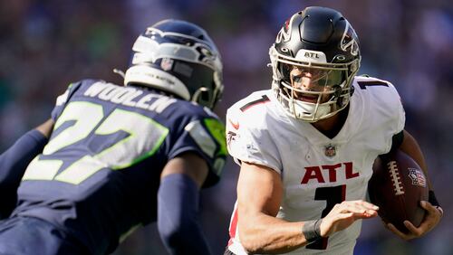 Atlanta Falcons quarterback Marcus Mariota runs with the ball during the second half of an NFL football game against the Seattle Seahawks, Sunday, Sept. 25, 2022, in Seattle. (AP Photo/Ashley Landis)