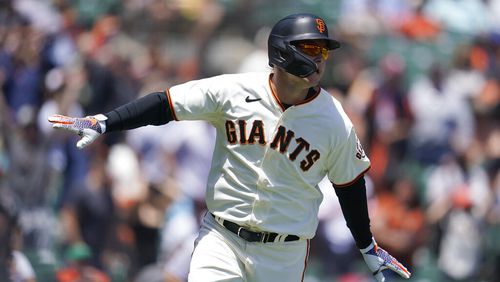 San Francisco Giants' Joc Pederson watches his a two-run home run during a baseball game against the New York Mets in San Francisco, Wednesday, May 25, 2022. (AP Photo/Jeff Chiu)