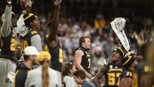 Kennesaw State University football players cheer on the bench at the game against Jacksonville State at SunTrust Park, Saturday, Nov. 17, 2018, in Atlanta. (Annie Rice/AJC)
