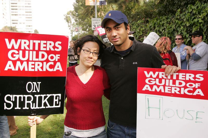 Actor Kal Penn (R) and writer Sara Hess march during a strike held by the Writers Guild of America (WGA) outside Fox Studios on November 9, 2007 in Century City, California. Over 12,000 members of the WGA are on strike against producers and studios demanding for a greater share of new media revenue. (Photo by Noel Vasquez/Getty Images)