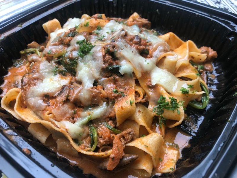 An order of bolognese brings ribbons of tagliatelle in a creamy sauce with ground ostrich meat along with mushrooms and spinach. LIGAYA FIGUERAS/LIGAYA.FIGUERAS@AJC.COM