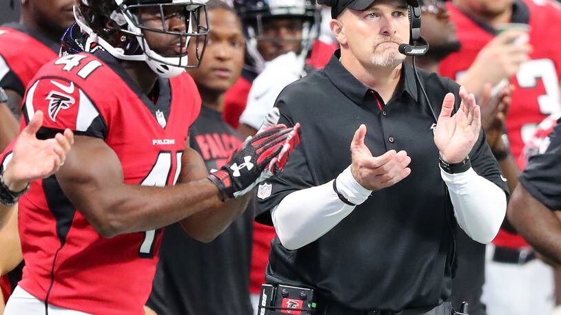 No shortage of encouragement on the Falcons sidelines: Head coach Dan Quinn applauds his defense earlier this season. (Curtis Compton/ccompton@ajc.com)