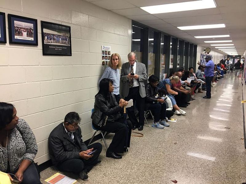 Voters wait in lone as voting machines are down at Annistown Elementary School in Snellville. Photo: Amanda C. Coyne