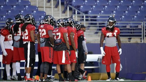 Atlanta Falcons’ Desmond Trufant, right, stands with teammates during a practice at the University of Washington Wednesday, Oct. 12, 2016, in Seattle. Trufant played college football at the school. Rather than head home, the team traveled directly to Seattle after their football game Sunday in Denver, ahead of playing the Seattle Seahawks this coming Sunday, Oct. 16, in Seattle. (AP Photo/Elaine Thompson)