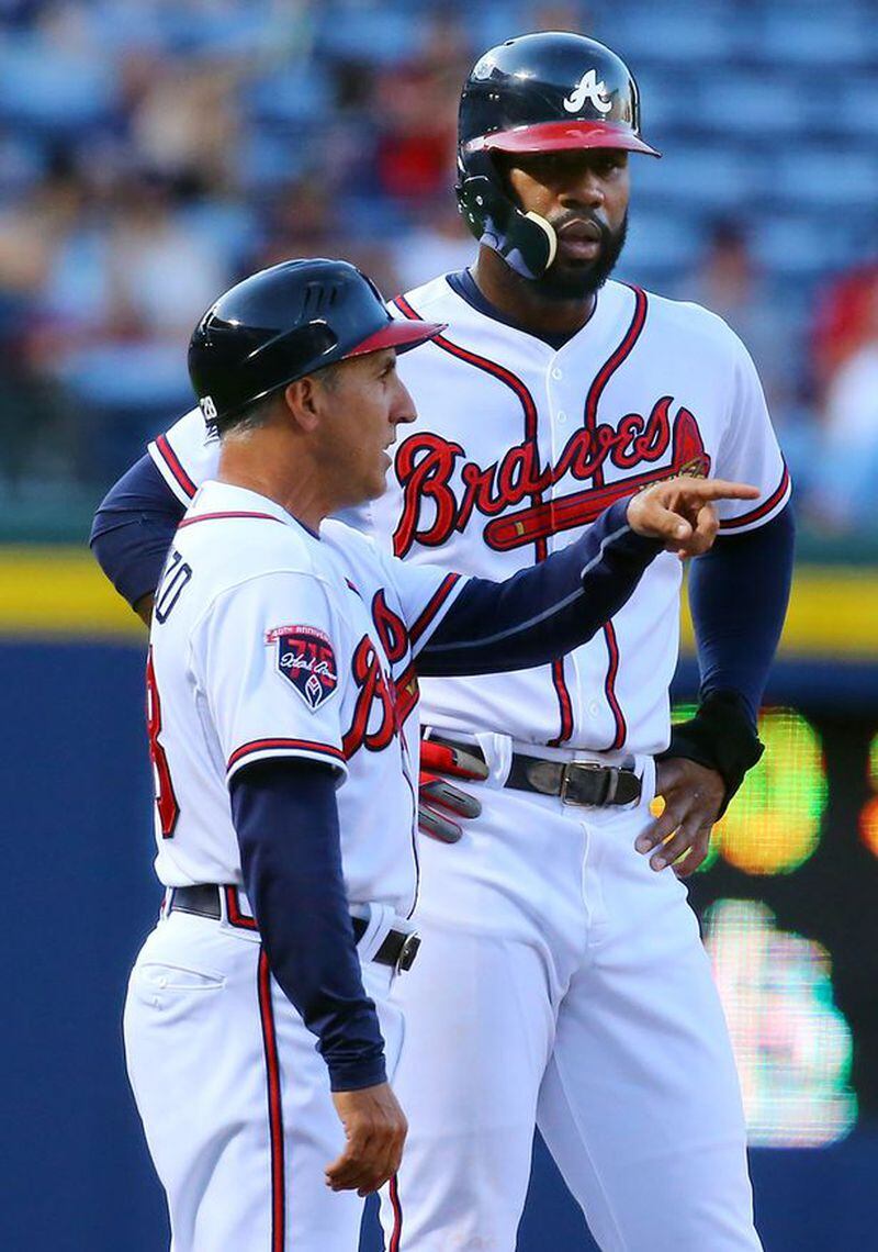 Jason Heyward is 6-for-8 against Friday's Cubs starter Jason Hammel. Heyward is also really large, as this photo of him next to third-base coach Doug Dascenzo illustrates. (Curtis Compton/AJC)