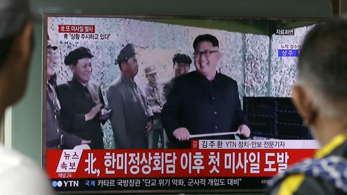 A TV news program shows a file image of North Korean leader Kim Jong Un, at Seoul Railway Station in Seoul, South Korea. in Seoul, South Korea, Tuesday, July 4, 2017. North Korea on Tuesday launched yet another ballistic missile in the direction of Japan, South Korean officials said, part of a string of recent test-firings as the North works to build a nuclear-tipped missile that could reach the United States. The signs read " North Korea launched a missile after a summit meeting of South Korea and the United States." (AP Photo/Ahn Young-joon)