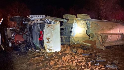 A distracted driver hauling gasoline flipped a truck Sunday, according to the Georgia Department of Public Safety.