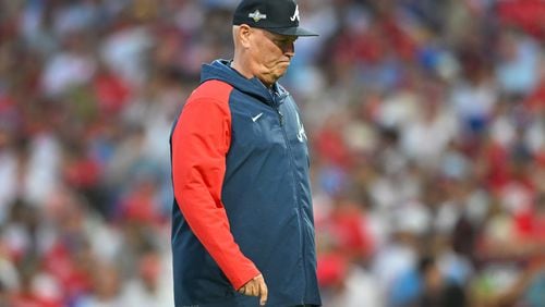 Atlanta Braves manager Brian Snitker walks back to the dugout after a pitching change against the Philadelphia Phillies during the third inning of NLDS Game 3 in Philadelphia on Wednesday, Oct. 11, 2023.   (Hyosub Shin / Hyosub.Shin@ajc.com)