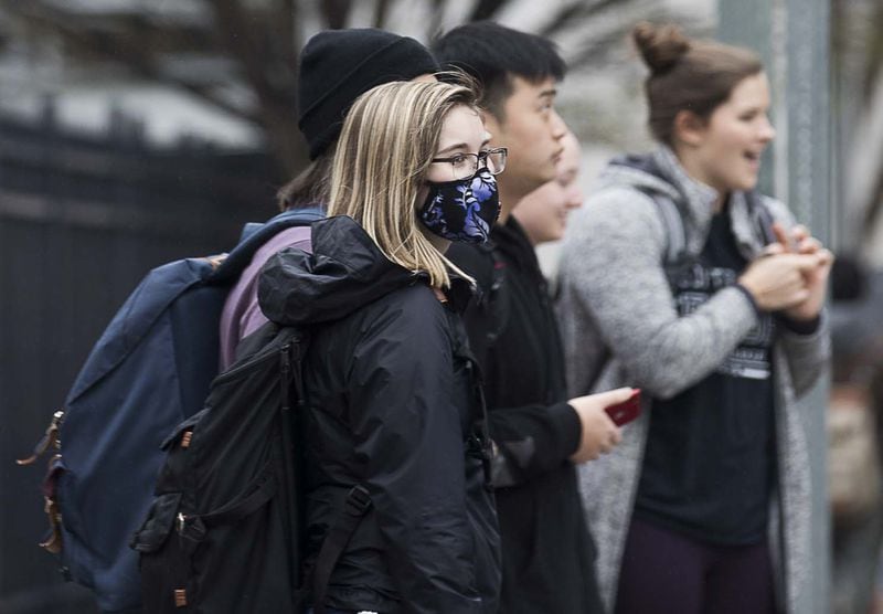 Georgia State University undergrad sophomore Emma Berman wears a face mask while navigating the university’s campus in Atlanta, Tuesday, March 10, 2020. Berman, a Cobb County resident who has asthma, says she wears the mask for herself but also because her mother has an auto immune disorder. University System of Georgia schools will require students to wear face coverings in classrooms and other campus facilities starting July 15. ALYSSA POINTER / ALYSSA.POINTER@AJC.COM
